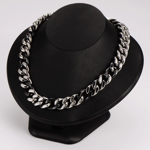 Hip hop style two-tone ceramic splicing thick chain necklace on a black mannequin display