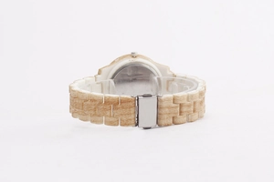 Detailed back view of a wood texture ladies watch showing the strap and silver metal buckle