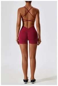 Rear view of seamless yoga set with burgundy cross-back sports bra and scrunch shorts