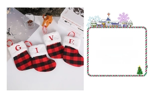 Detail of red buffalo plaid Christmas stockings with white faux fur trim and embroidered letters