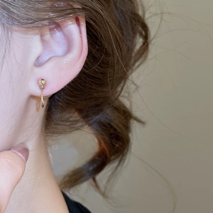Minimalist gold geometric ball earring shown on model with vintage court style details