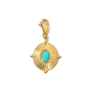 Detail of a sun-shaped gold charm with a turquoise stone and a lobster clasp hook