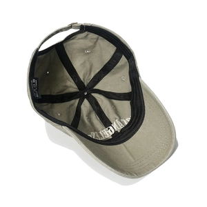 Detailed internal view of washed cotton baseball cap with 100% cotton label and metal buckle