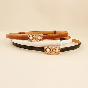 Three elegant slim leather waist belts with pearl-inlaid square gold buckles in studio set