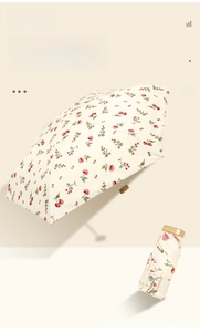 Flat six-fold sun umbrella featuring retro cherry print and compact cream-colored canopy