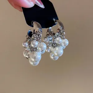 Silver-plated C-shaped cluster pearl earrings with cascading beaded tassel design