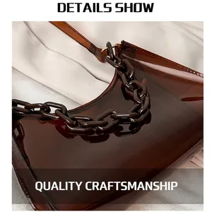 Brown translucent jelly shoulder bag with chunky plastic chain and PVC minimalist design