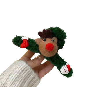 Christmas reindeer hair claw clip in dark green plush with Santa and sock charms