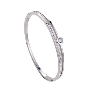 Elegant silver hollow bangle with white cubic zirconia inlay and central round stone