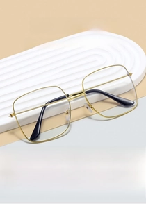 Close-up of golden metal frame square glasses with minimalist double-bridge details