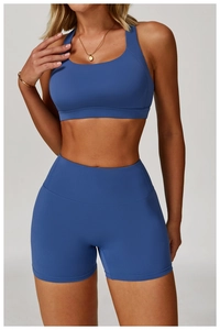 Front view of sky blue high-waist yoga shorts and racerback sports bra set
