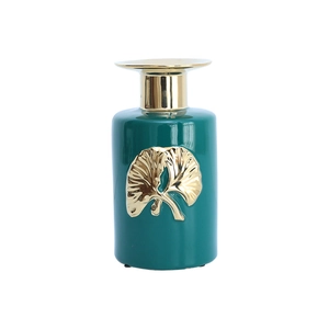 Modern emerald green ceramic vase with golden ginkgo leaf relief for luxury home decor
