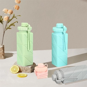Detailed view of collapsible silicone water bottles in various colors for outdoor travel