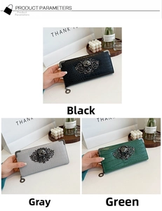 Detailed view of crocodile embossed leather clutches with ornate metal skull ornaments