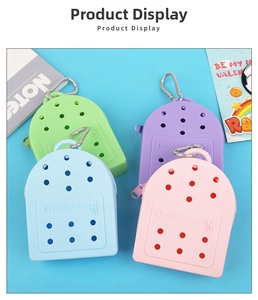 Close-up of colorful silicone mini coin purses with metal hooks in four pastel colors