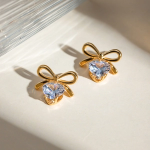 18k gold plated stainless steel bow earrings with heart-shaped white zircon pendants