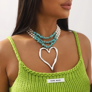 Bohemian multilayered turquoise and pearl necklace with a large heart pendant
