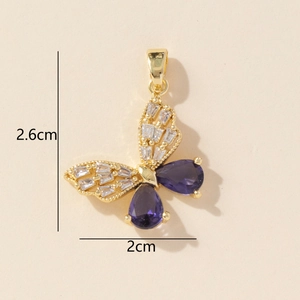 Detailed view of butterfly pendant with purple drop stone and dimensions 2.6cm by 2cm