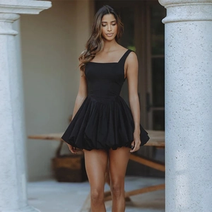 Detail of elegant black sleeveless puff dress with square neckline and flared hemline