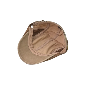 Detail view of khaki cotton beret showing inner lining texture and stitched wash label