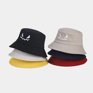 Close-up of Halloween bucket hats in six colors with detailed monster face embroidery