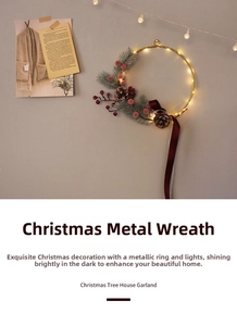 Detail of Christmas metal wreath with warm LED lights, pine cones and red berries on wall
