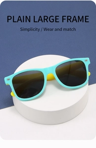 Detail of plain large frame kids sunglasses with rivets and blue yellow contrast colors