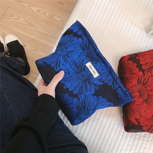 Detail of floral embossed canvas pouches with embroidery and simple wish label