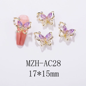 Macro detail of 17x15mm butterfly nail charms with purple crystal and white pearls