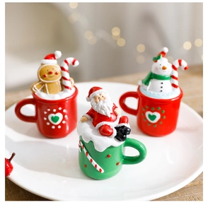 Detailed view of 3-piece Christmas resin ornaments featuring Santa, Snowman and Gingerbread