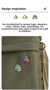 Detail of cartoon sloth enamel pins decorated on an olive green canvas bag