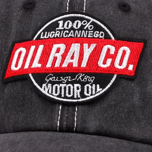 Classic retro baseball cap featuring vintage motor oil embroidery on washed grey fabric