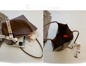 Deep brown tote bag detail showing large capacity for tablets and daily items
