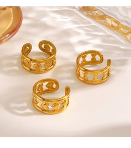 Three-piece set of golden open rings featuring shell, bow, and heart cutout designs