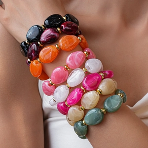 Colorful irregular acrylic bead bracelet with marble texture and golden spacers