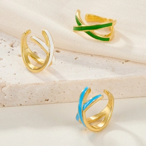 Three gold-plated S925 sterling silver ear cuffs with colorful enamel in blue and green