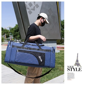 Blue oxford fabric travel bag featuring quilted diamond pattern and a front zipper pocket