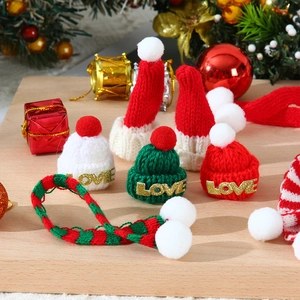 Mini knitted Christmas hats and scarves set in red and green for festive doll decorations