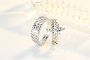 Detailed shot of S925 silver couple rings featuring crown design and geometric patterns