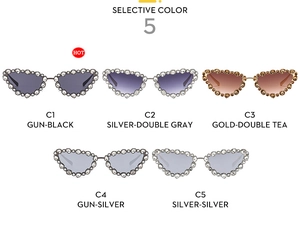 Detail showing various colors of luxury cat-eye sunglasses with rhinestone frames