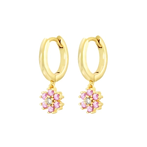Detailed shot of gold hoop earrings with pink flower zircon pendants on white background