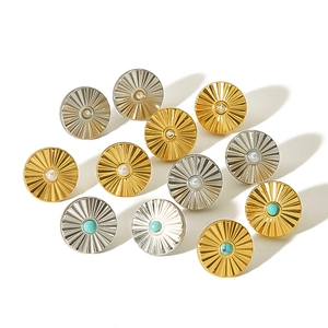 Fashion wave titanium steel earrings with pearls and turquoise on white background