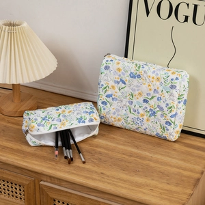 Quilted cotton makeup bag set with floral rabbit print and silver zipper detail