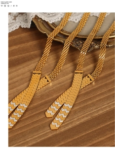 Detail of gold-tone mesh tie necklaces with V-shaped rhinestone and plain metal pendants