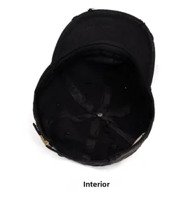 Detail of the black cotton baseball cap showing internal structure and distressed brim