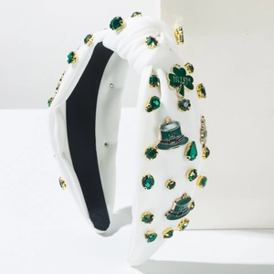 Close-up of Saint Patrick's Day headband with green gems, Irish clover and lucky hat