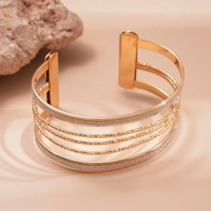 Minimalist gold multi-layer geometric open cuff bracelet with metallic glitter finish