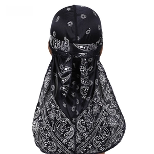 Back view of navy paisley durag showing long straps and silky satin fabric texture