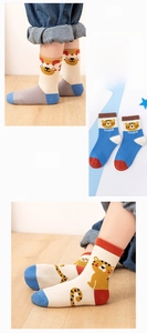 Detail showing cartoon tiger patterns and stripe designs on cotton knit children socks