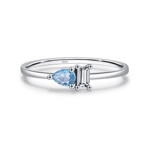 Minimalist 925 sterling silver ring featuring a pear-cut blue gemstone and clear zircon